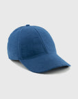 Blue baseball cap on a light gray background