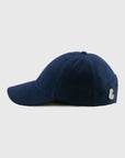 Navy blue cap with a logo on a light gray background
