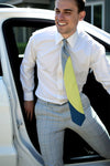 Lesovs Gray Acid Yellow Eclipse Silk Tie with man getting out of car