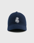 Navy blue cap with a white logo on a light gray background