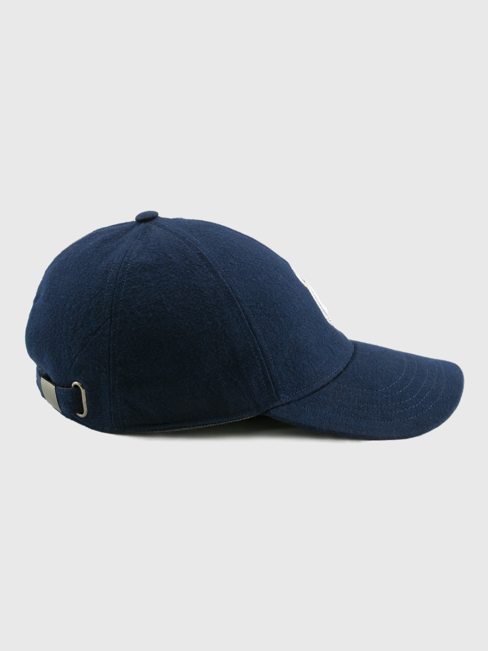 Navy blue baseball cap on a light gray background