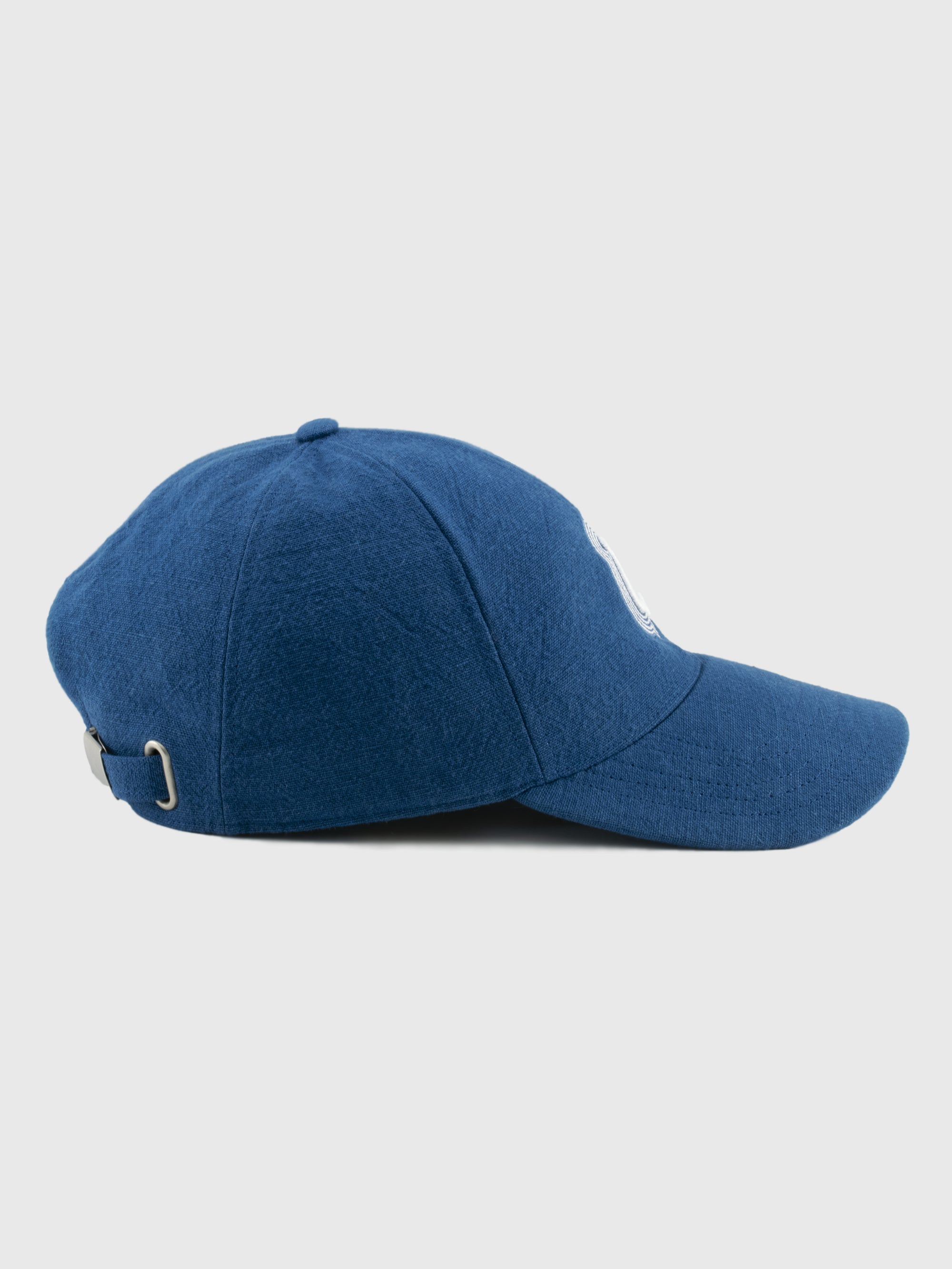Blue baseball cap on a light gray background