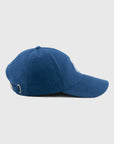 Blue baseball cap on a light gray background