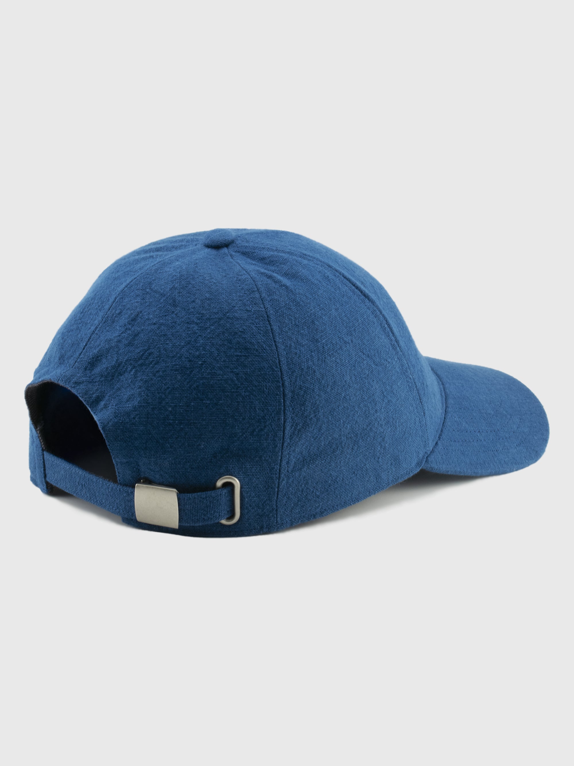 Blue baseball cap on a light gray background