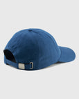 Blue baseball cap on a light gray background