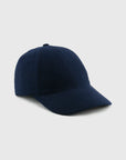 Navy blue baseball cap on a light gray background