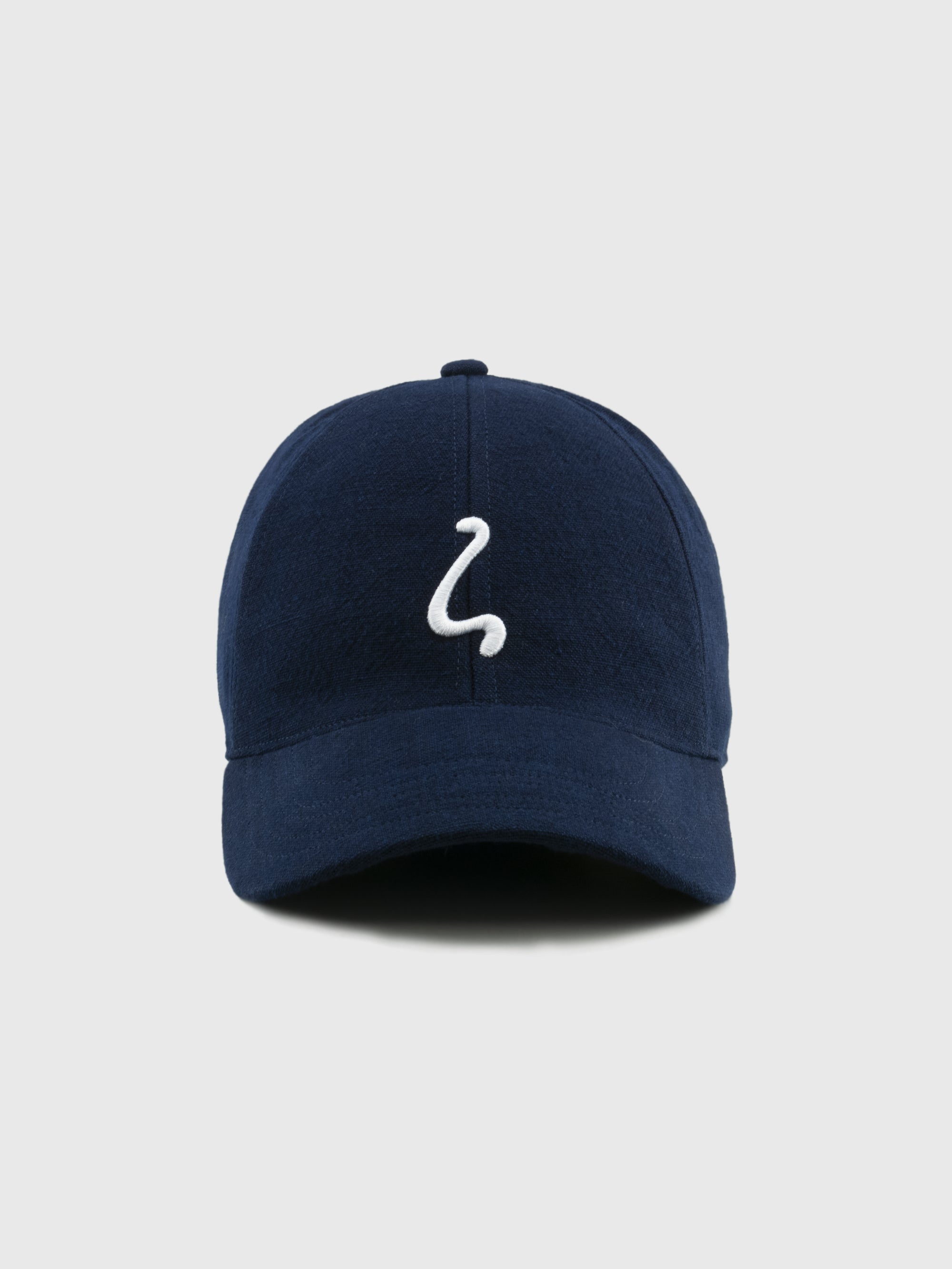 Navy blue cap with a white logo on a light gray background