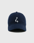 Navy blue cap with a white logo on a light gray background