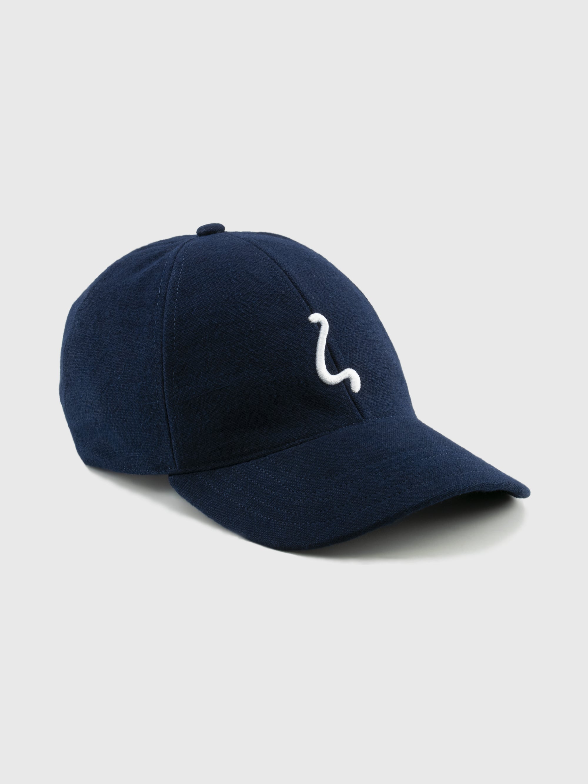 Navy blue cap with a white logo on a light gray background