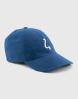 Blue baseball cap with a white logo on a light gray background