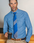 Lesvos Blue and Gray Stripe Silk Tie with man holding mug